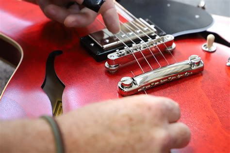 How to Replace Guitar Strings Electric: A Symphony of Chaos and Order